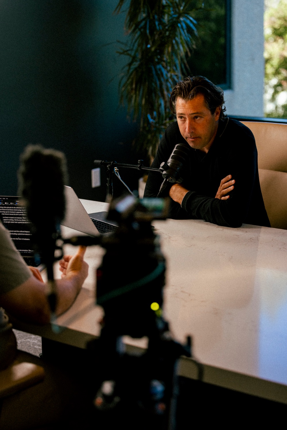 Mikey Taylor speaking during a live studio recording