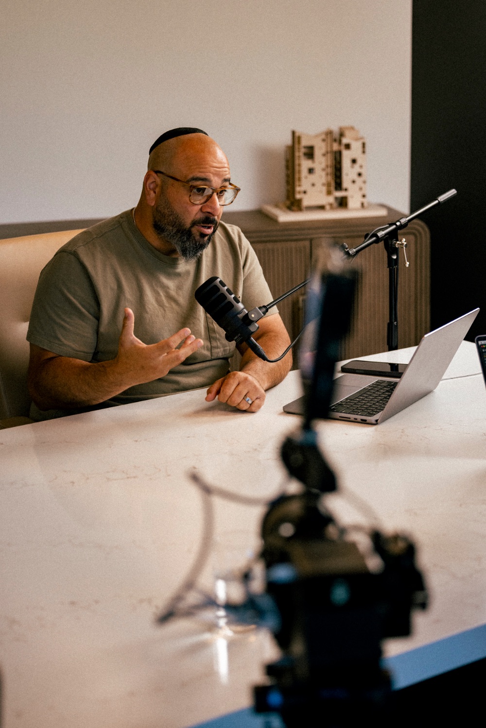Michael Michalov speaking during a live studio recording